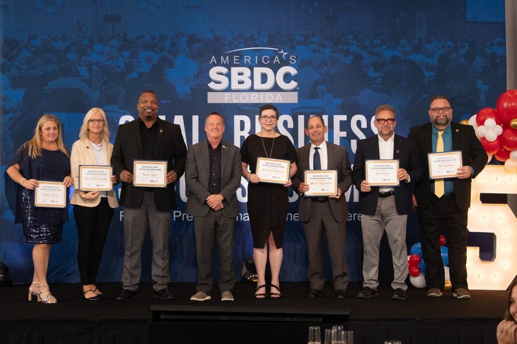 Figure 2 Debra Schweikowsky, Randy Hayes, Greg Britton (Florida SBDC Network State Director), Kurt Forster, Carl Hadden (Florida SBDC at USF Regional Director); other winners.